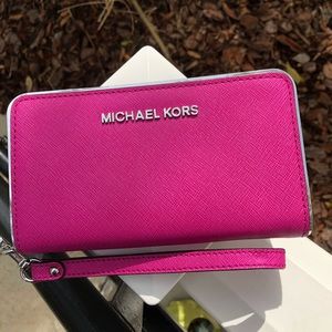 Pink Michael Kors wristlet wallet